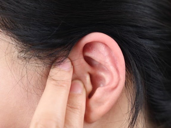 Magnified side view of woman's ear